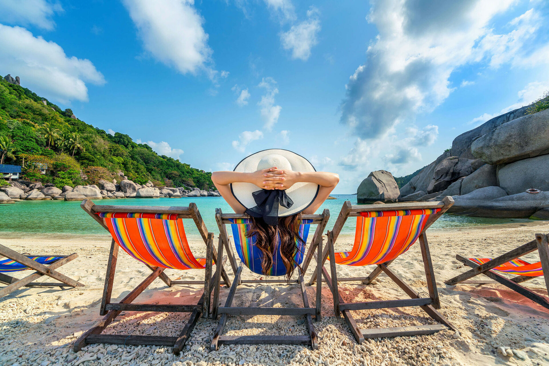woman-with-hat-sitting-on-chairs-beach-in-beautiful-tropical-beach-woman-relaxing-on-tropical-beach-at-koh-nangyuan-island-(1)